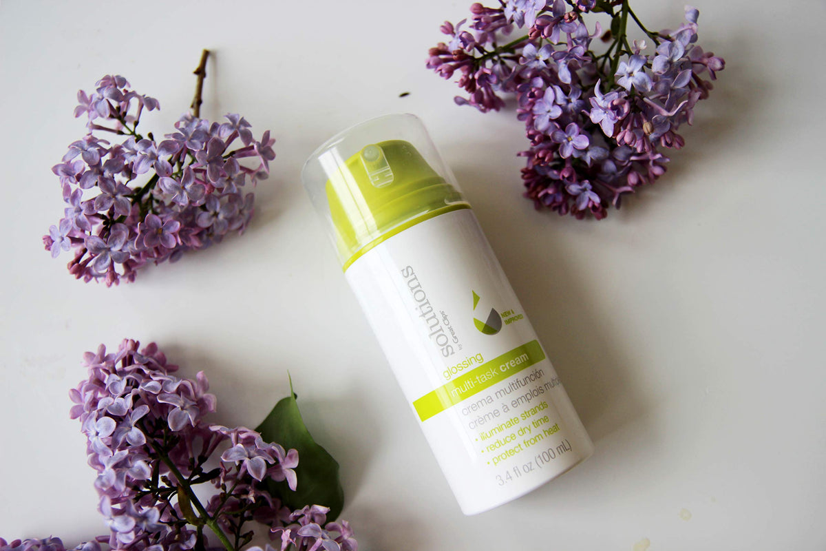 GREAT CLIPS Glossing Multi-Task Cream demonstrates frizz-control on hair.