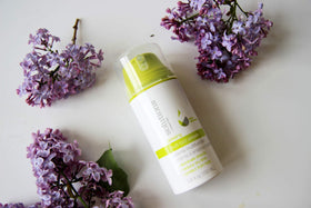 GREAT CLIPS Glossing Multi-Task Cream demonstrates frizz-control on hair.