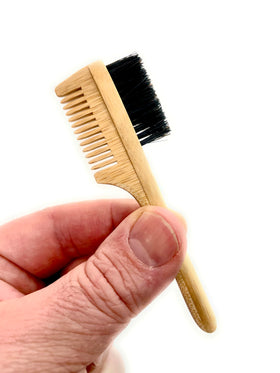 Green Beard Grmng boar bristles close-up smoothing flyaways.