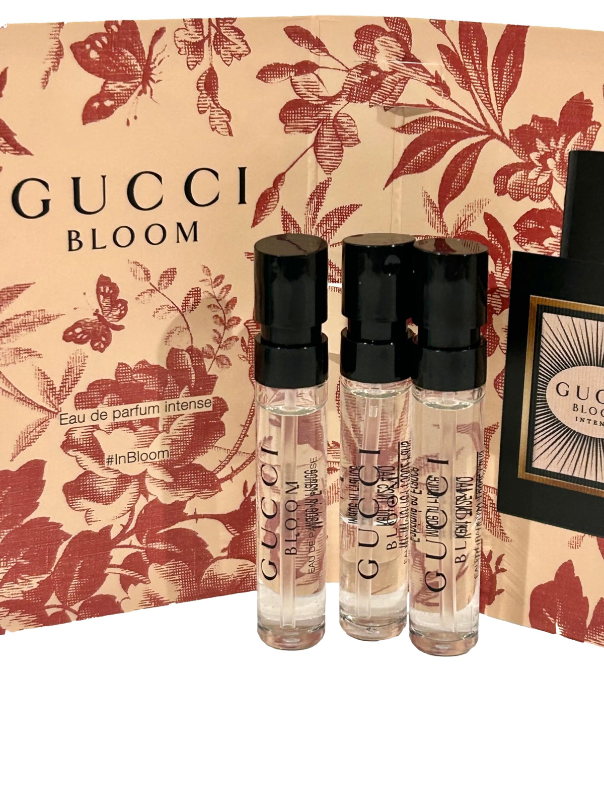 Gucci Bloom packaging close-up highlighting the elegant 3-sample set.