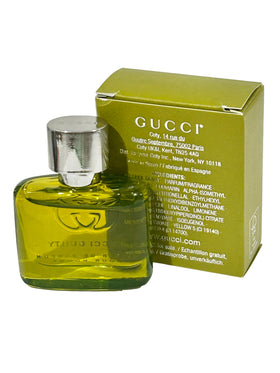 Gucci Guilty Elixir amber woody essence in focus, suggesting versatile daily wear.