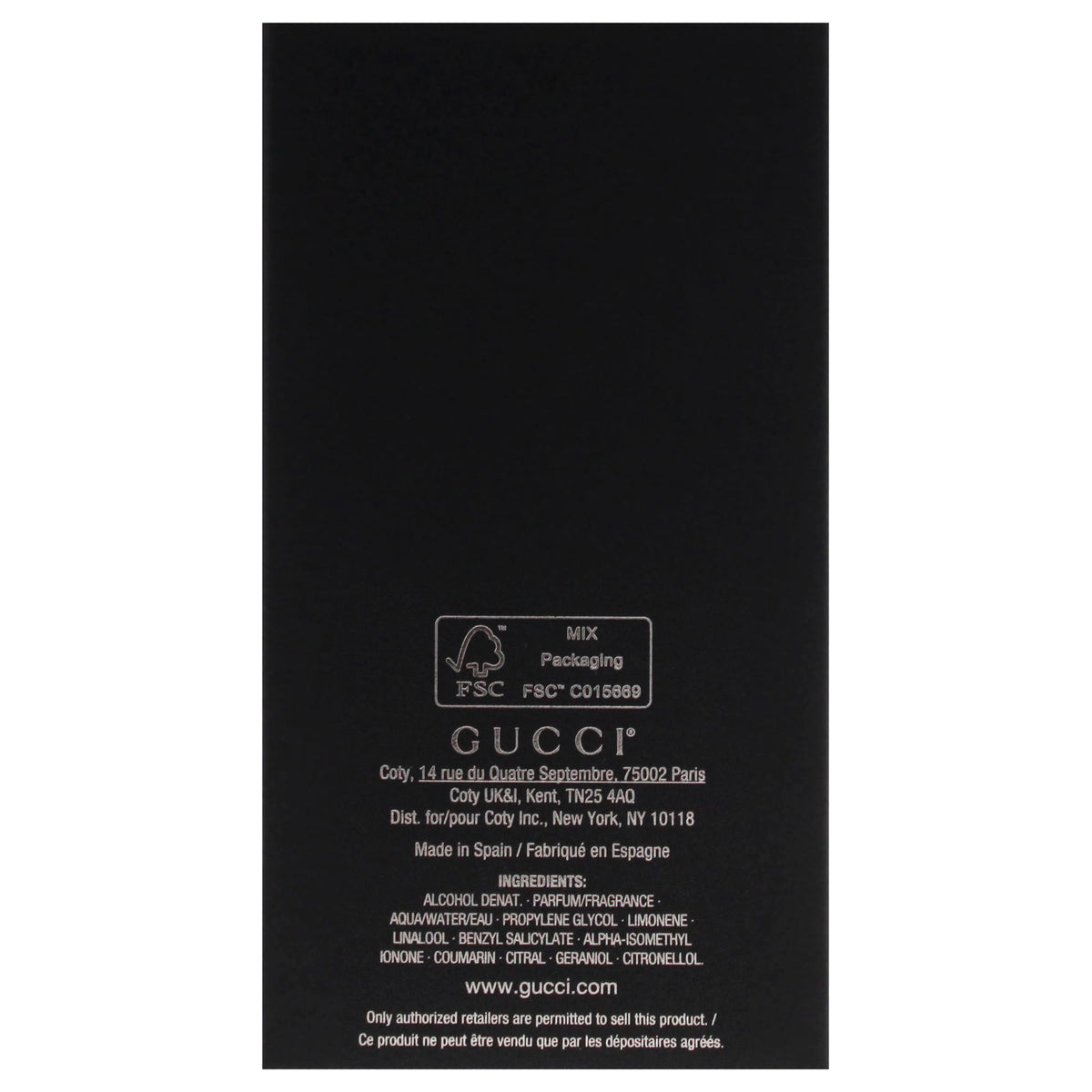 Gucci Guilty Men label detail showcasing brand notes and style.