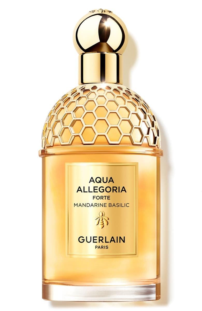 Guerlain Aqua Allegoria Forte Mandarine Basilic bottle with pour, showcasing bright citrus and vanilla warmth.