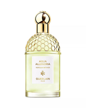 Guerlain Nerolia Vetiver bottle with bee emblem, refillable packaging for sustainable luxury.