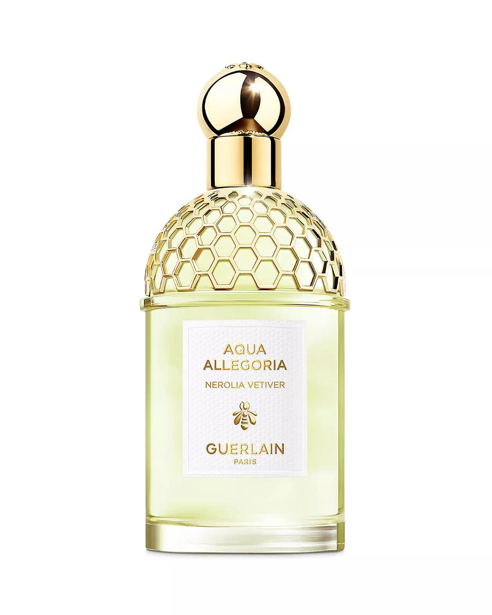 Guerlain Nerolia Vetiver bottle with bee emblem, refillable packaging for sustainable luxury.