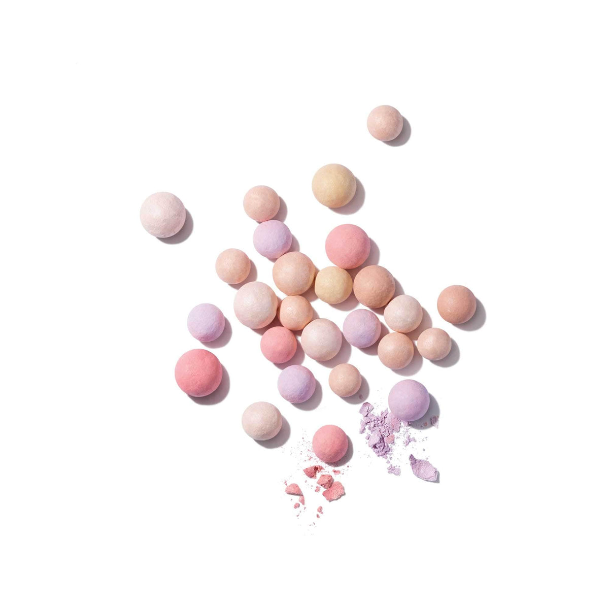 Guerlain Météorites Travelling Pearls glow finish on bare skin for refined radiance.