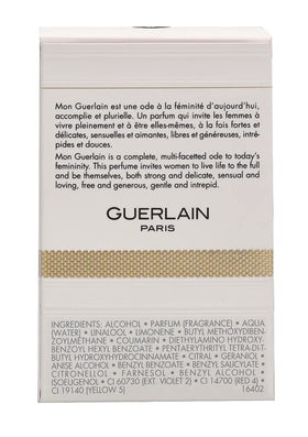Guerlain Mon Guerlain flacon glass reflection, premium fragrance presence.