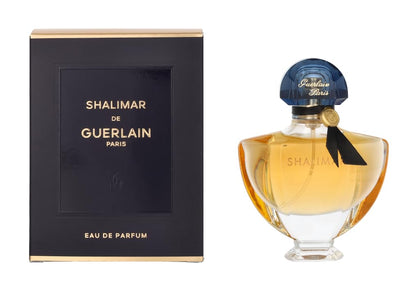 Guerlain Shalimar Eau de Parfum spray bottle on vanity, ideal for romantic evenings