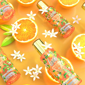 GUESS Love Sunkissed Flirtation Mist label closeup shows apricot and freesia notes