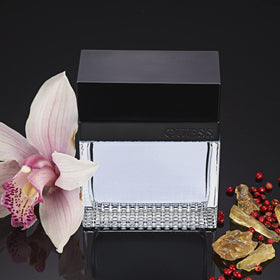 Base notes panel with GUESS Seductive Homme amberwood and sandalwood warmth.