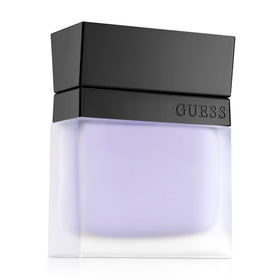 Pouring GUESS Seductive Homme into the palm for quick absorption.
