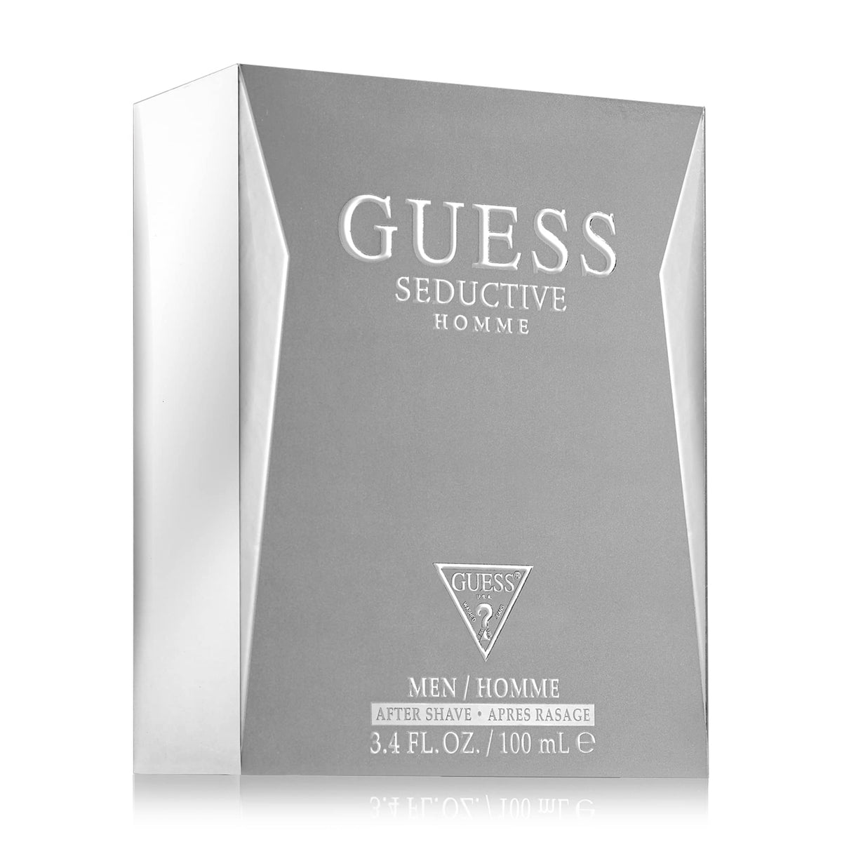 Store display featuring GUESS Seductive Homme bottle and packaging.