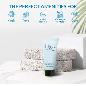 H2O Therapy travel-size conditioner closeup 0-85oz shows convenient, leak-resistant packaging for hotels.