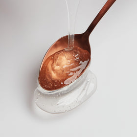 Hair Food shampoo close-up shows creamy coconut milk scent.