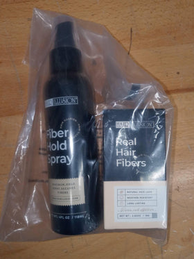 Hair Illusion hold spray applied to lock fibers in place for gym-ready wear