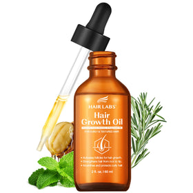 Hair Labs Hair Growth Oil bottle being poured for easy scalp application.