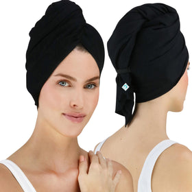 Hair RePear ultimate hair towel close-up on smooth cotton surface for gentle drying.