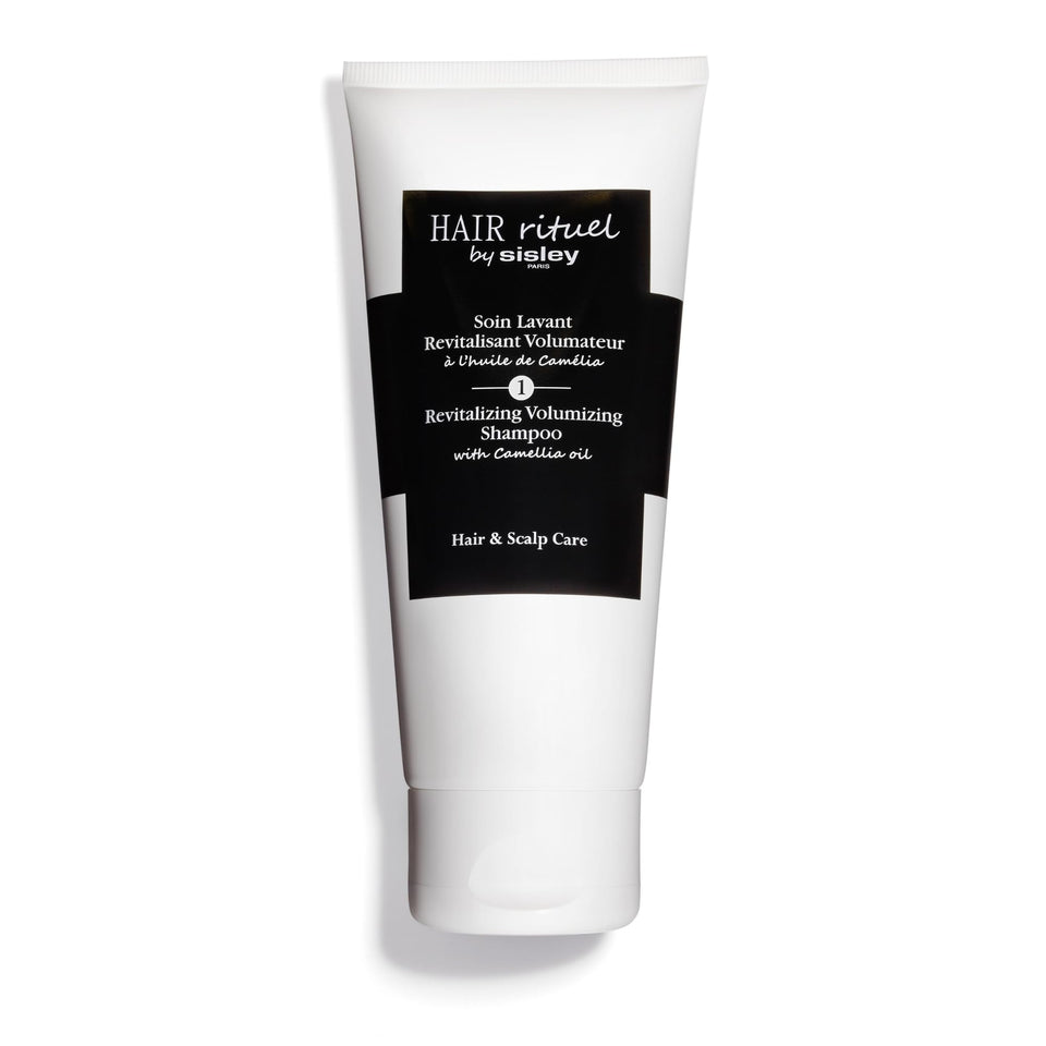 Hair Rituel by Sisley Camellia Oil shampoo bottle highlights scalp vitality.