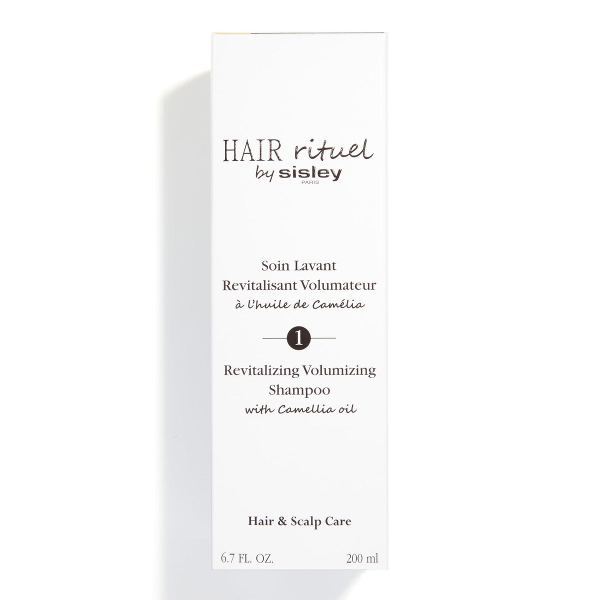 Hair Rituel by Sisley application on scalp demonstrates easy massaging ritual.