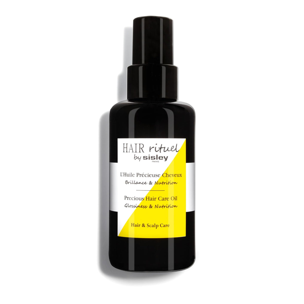 Hair Rituel by Sisley Precious Hair Oil bottle for nourishment and shine.