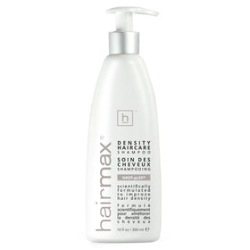 Hairmax Density Shampoo bottle pour showcases premium formula for fuller-looking hair.