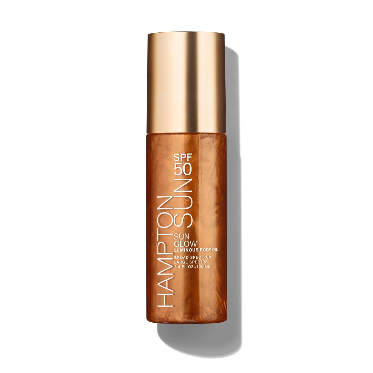 Hampton Sun SPF 50 Sun Glow bottle pour for quick protection and luminous glow.