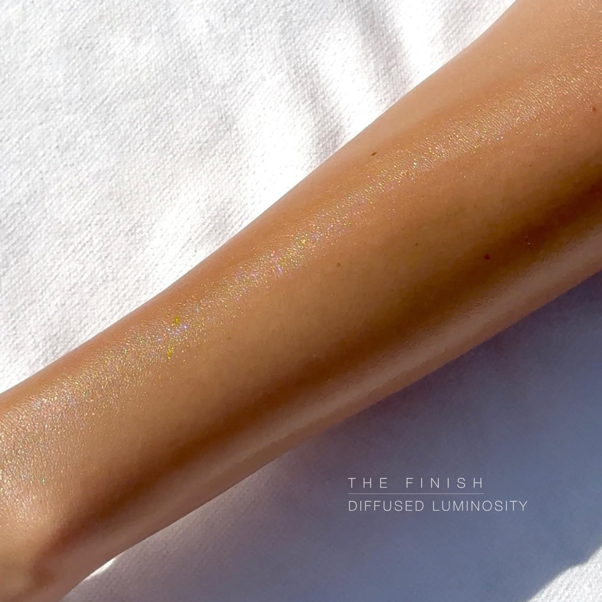 Hampton Sun SPF 50 Sun Glow on skin shows radiant shimmer and even tone.