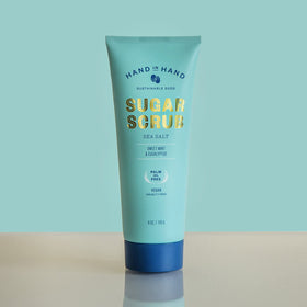 Hand in Hand Sugar Scrub ingredients coconut oil providing deep hydration.