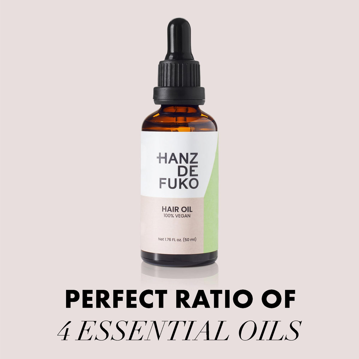Hands applying Hanz de Fuko vegan oil to damp hair for soft shine