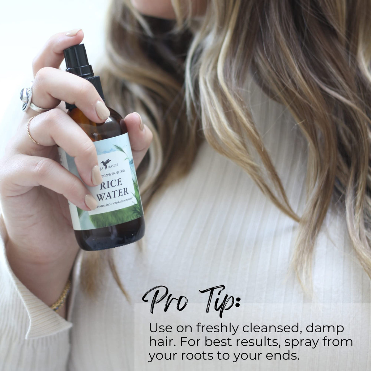 Happi Hummingbyrd hair strands showing detangled, smoother texture after spray.