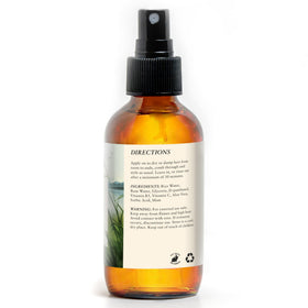 Happi Hummingbyrd bottle on wet hair for even moisture and frizz control.