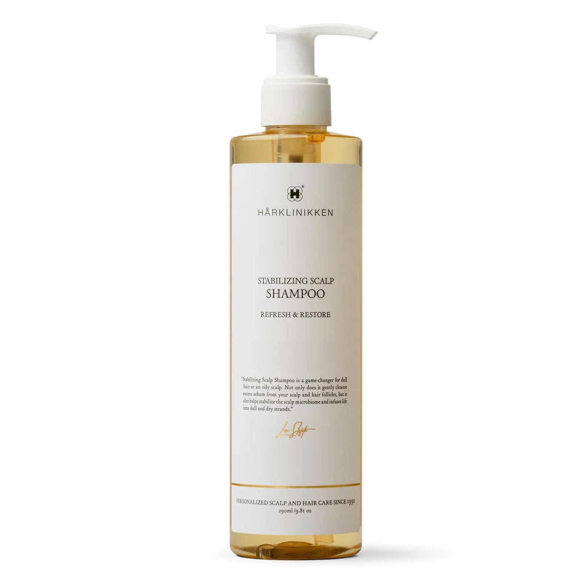 Harklinikken Stabilizing Scalp Shampoo bottle on sink showing refreshed scalp