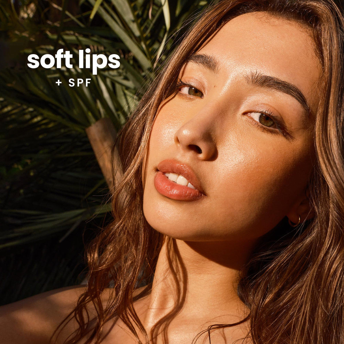 Hawaiian Tropic lip balm Island Coconut tube close-up emphasizes vitamin E and shea butter hydration