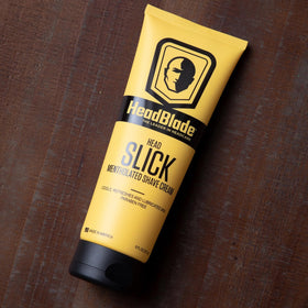 HeadSlick bottle-pour demonstrates easy rinsing after blade passes.