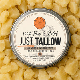 Hearthical Just Tallow scoop between fingers melts onto skin for easy use.