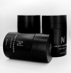 Heavy Handed The Cream bottle close-up highlights fast-absorbing hand care.