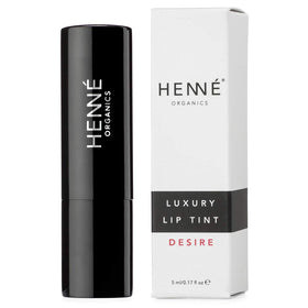 Luxurious Henné Organics packaging highlighting premium eco-friendly design.