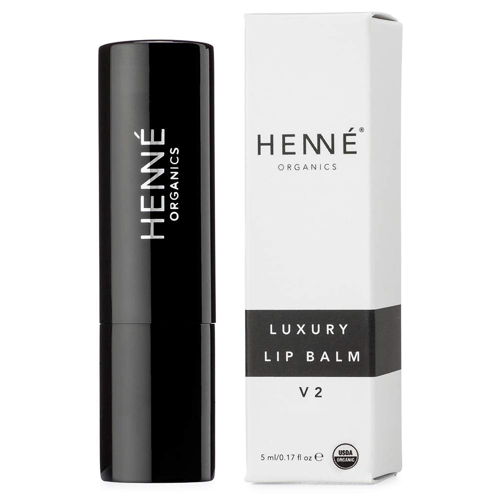Swatch of Henné Organics Lip Balm V2 on a fingertip for quick hydration.