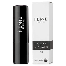 Swatch of Henné Organics Lip Balm V2 on a fingertip for quick hydration.