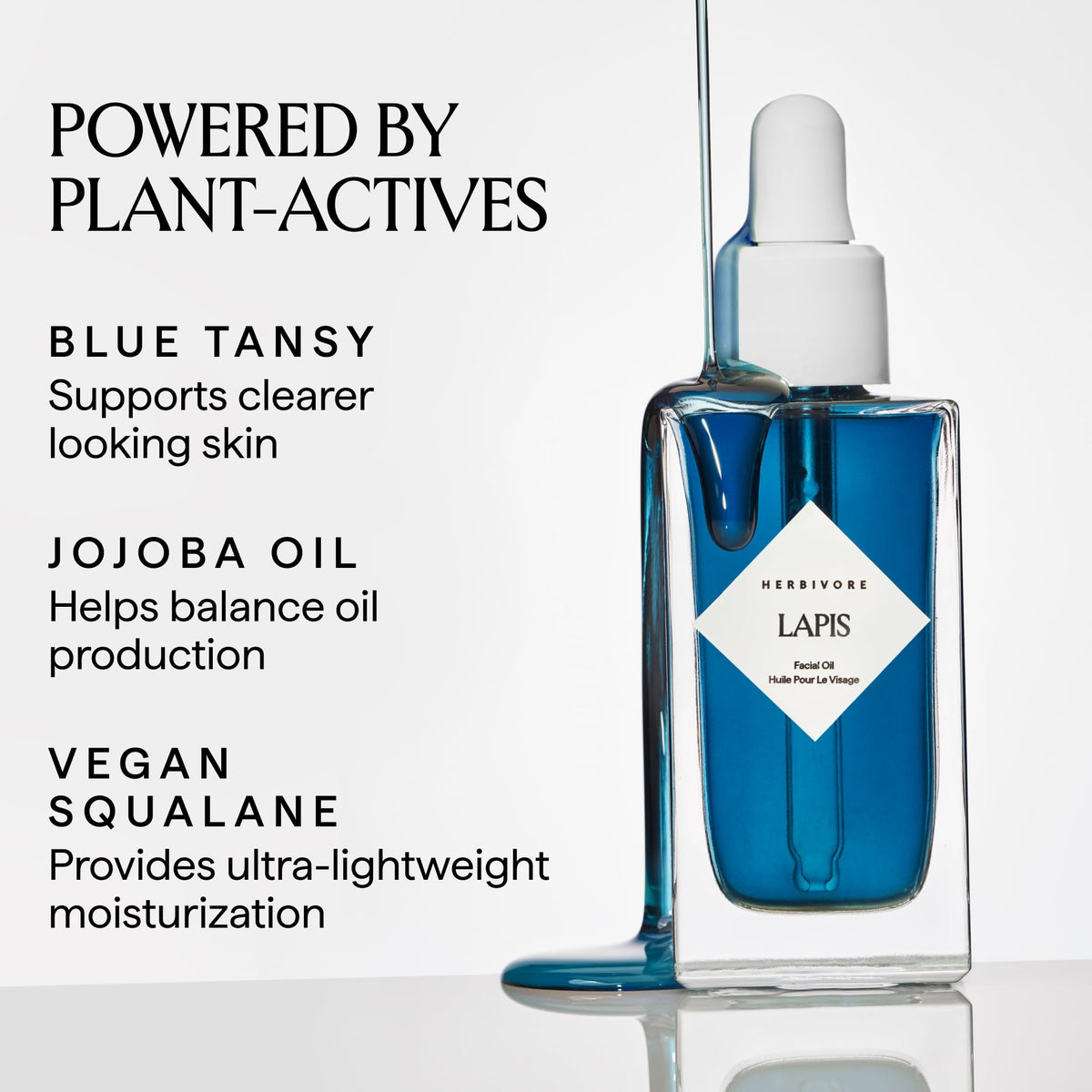 HERBIVORE Lapis Blue Tansy Oil bottle closeup highlighting Azulene