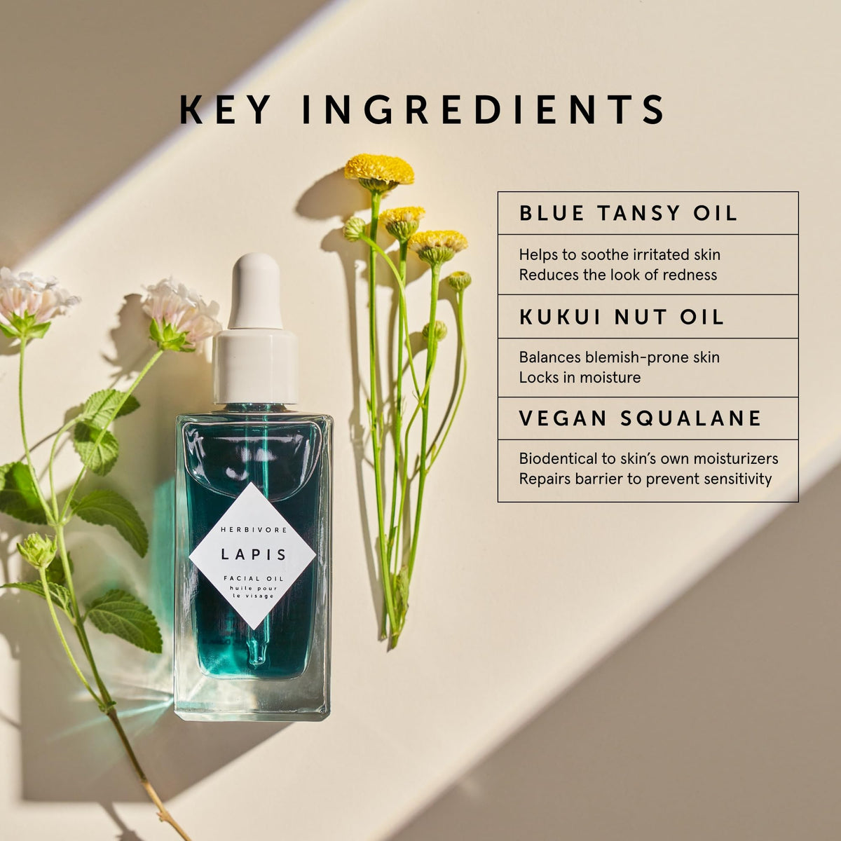 HERBIVORE Lapis Facial Oil bottle in use with gentle facial massage.