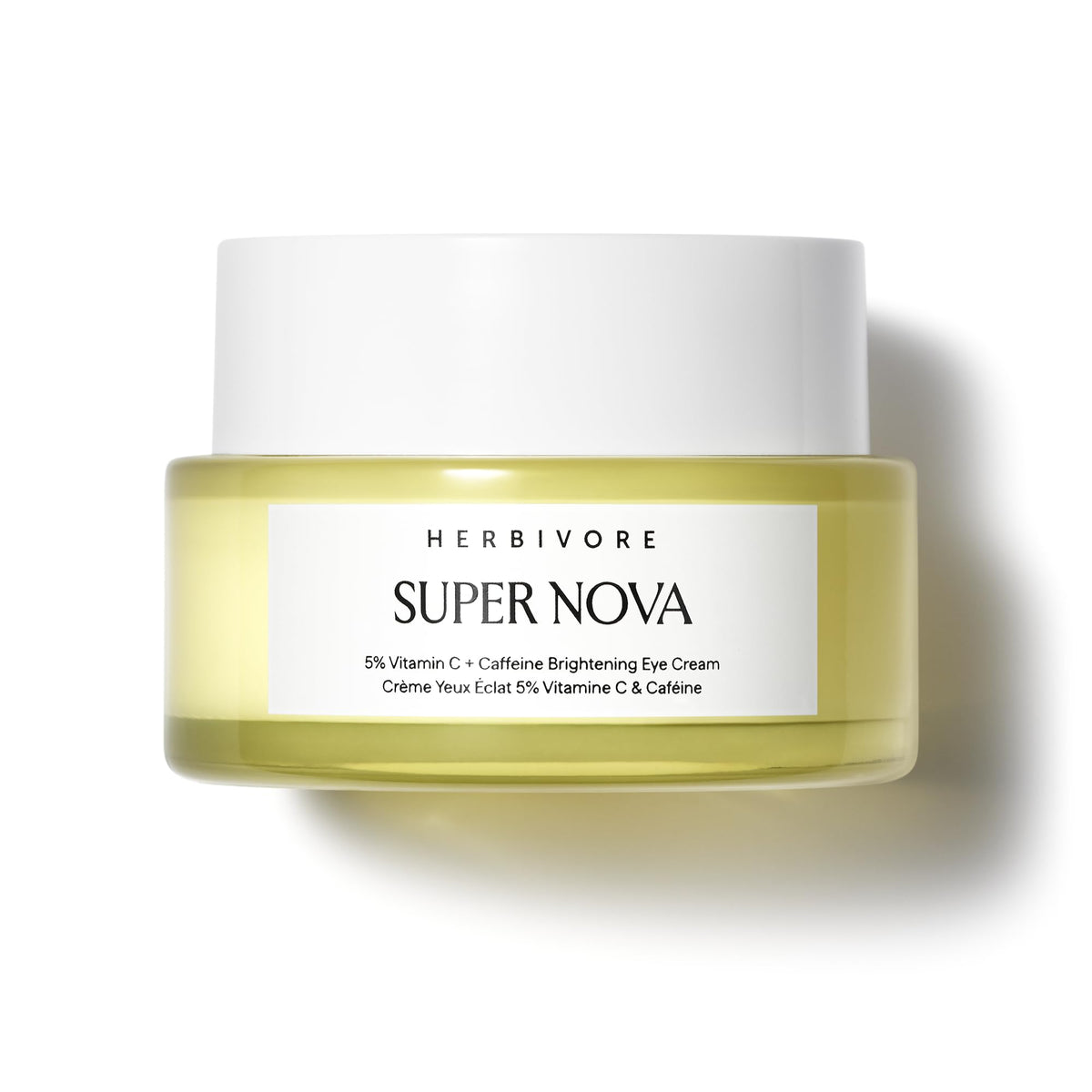 HERBIVORE Super Nova Eye Cream tube close-up emphasizes brightening effect.