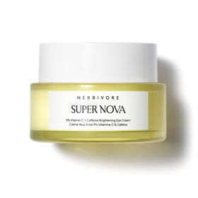 HERBIVORE Super Nova Eye Cream tube close-up emphasizes brightening effect.