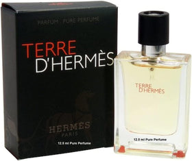 Close-up of Hermès Terre D'Hermès Pure mini bottle, great for on-the-go use.