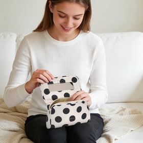 Hibilog compact makeup bag in white polka for easy daily storage.