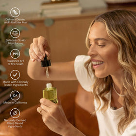 Highbrow Hippie Root Replenish serum texture being dispensed for fast absorption.