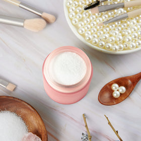 Hoa Kinh 4oz jar with pink lid open, showcasing easy access to products.