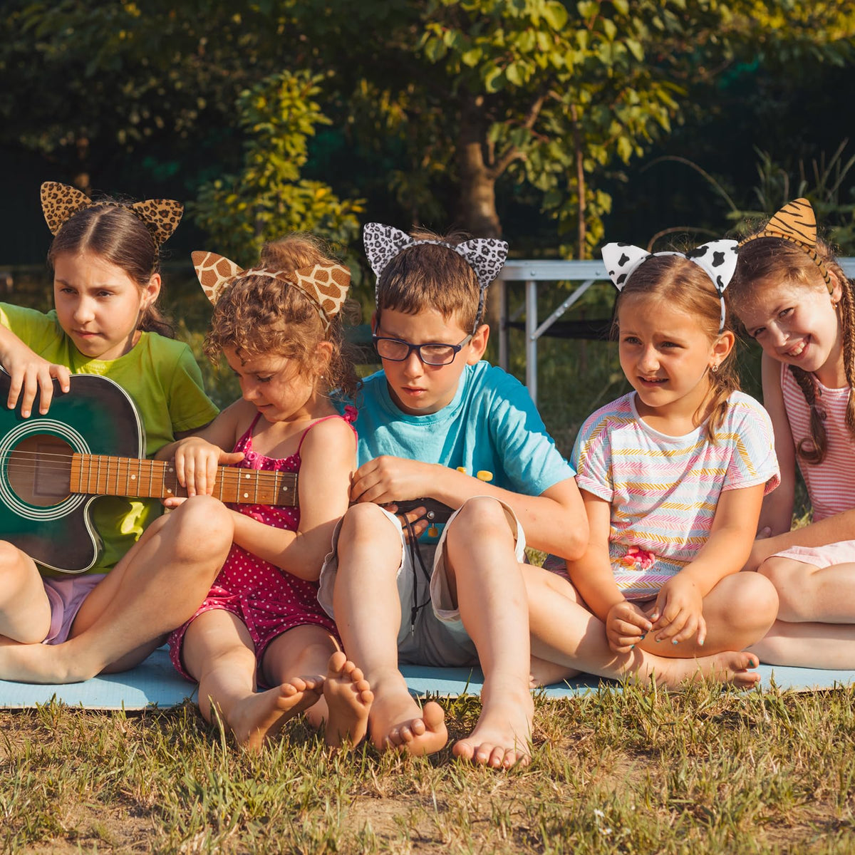 Hoemwarm giraffe ears headband creates whimsical safari styling.
