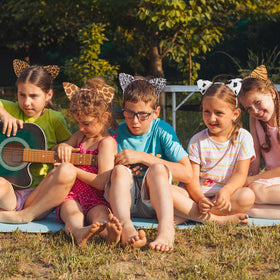 Hoemwarm giraffe ears headband creates whimsical safari styling.