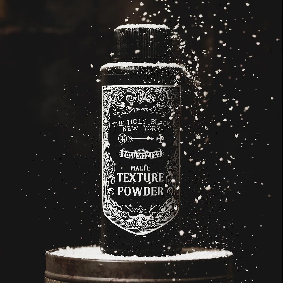 The Holy Black Matte Texture Powder closeup velvety finish adds depth.